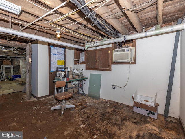 basement with a wall mounted air conditioner