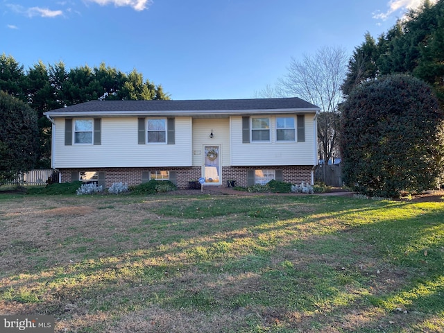 bi-level home with a front yard