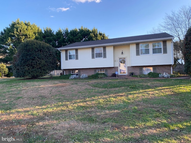 raised ranch featuring a front yard