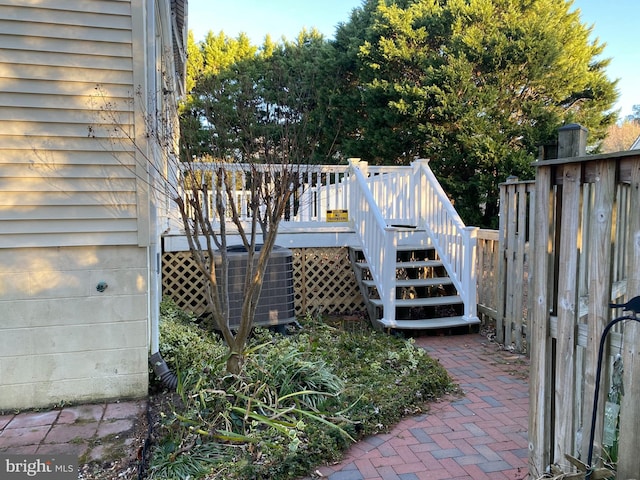 wooden deck with central air condition unit