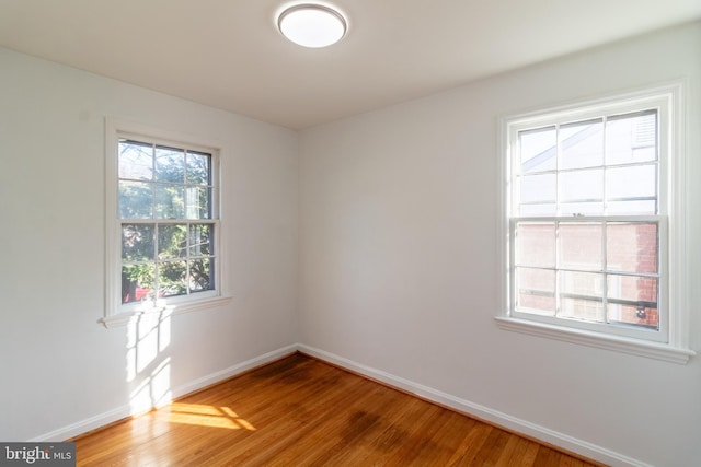 unfurnished room featuring hardwood / wood-style floors