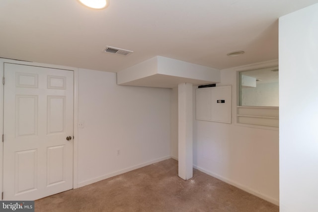 basement with light carpet