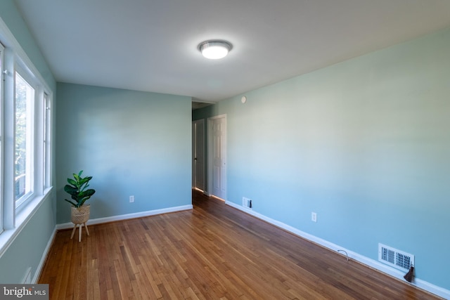 unfurnished room featuring wood-type flooring