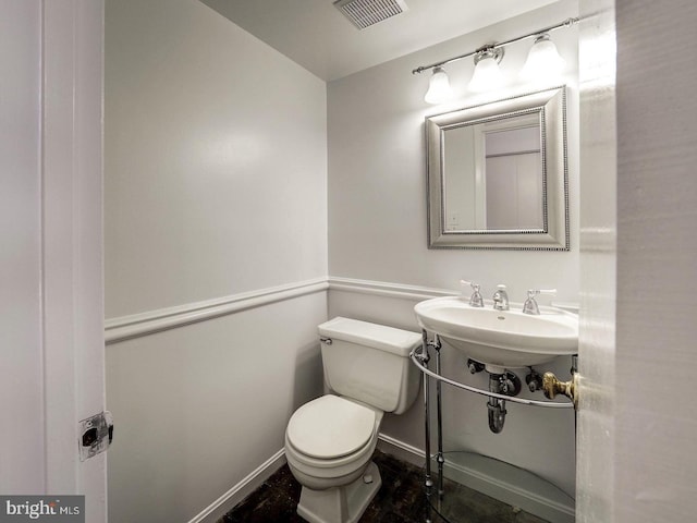 bathroom featuring sink and toilet