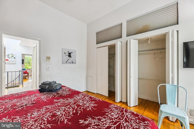 bedroom with hardwood / wood-style flooring