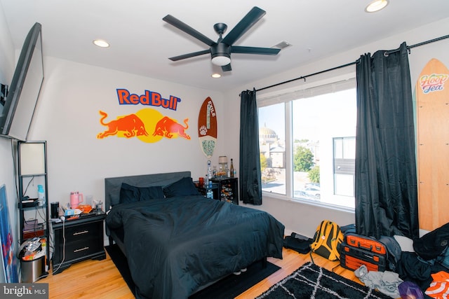 bedroom featuring ceiling fan and light wood-type flooring