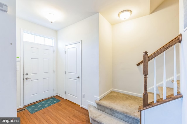 foyer entrance with light wood-type flooring