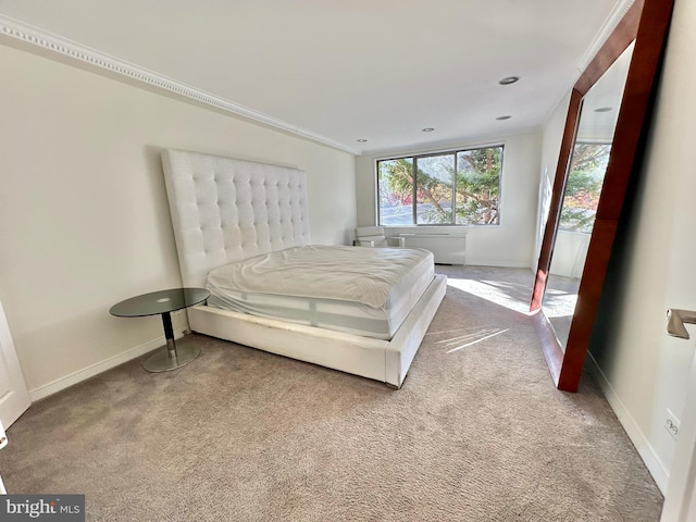 carpeted bedroom featuring crown molding