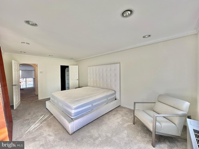 bedroom featuring carpet flooring and crown molding