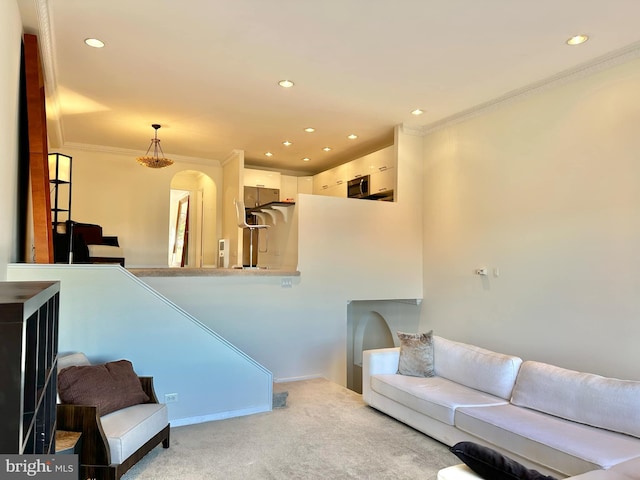 living room featuring light colored carpet and crown molding