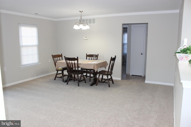 dining space featuring a notable chandelier, light colored carpet, and crown molding