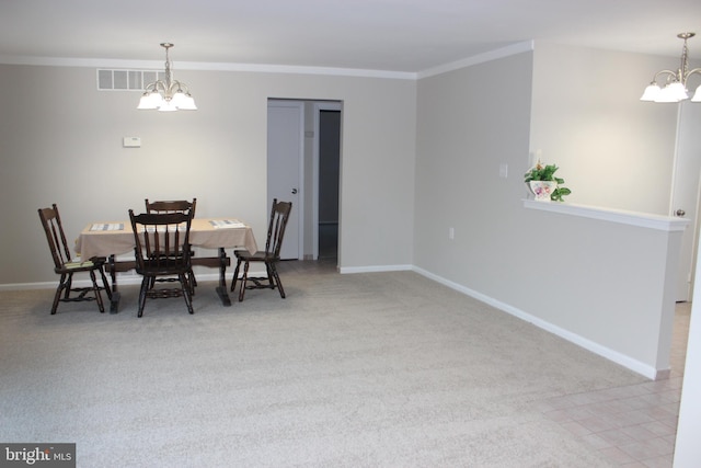 dining area featuring ornamental molding, light carpet, and an inviting chandelier