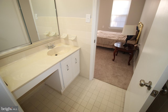 bathroom featuring tile patterned floors and vanity