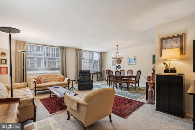 living room featuring light carpet and a notable chandelier