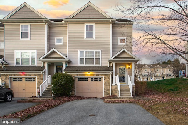 multi unit property featuring a garage