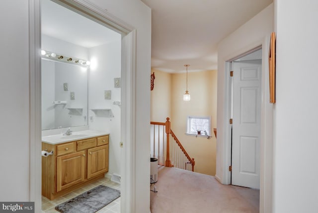 bathroom with tile patterned flooring and vanity