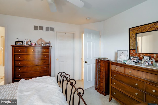 bedroom featuring light colored carpet and ceiling fan