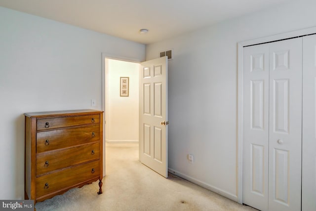 carpeted bedroom with a closet