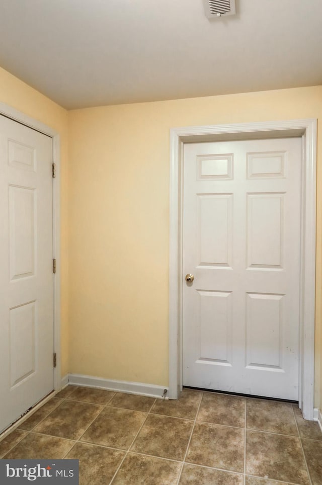 interior space with tile patterned floors