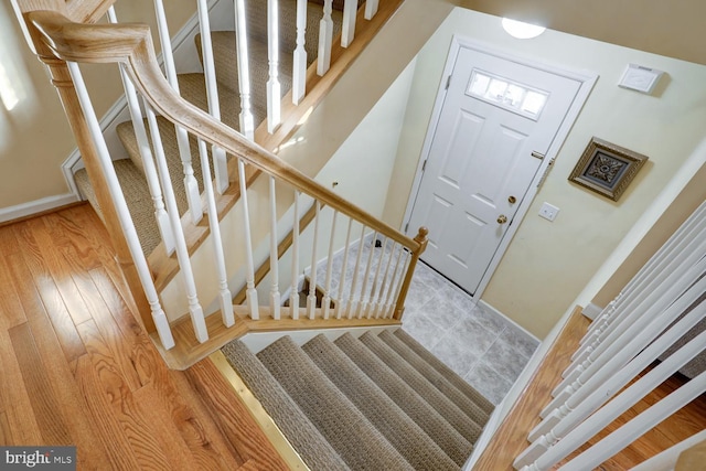 stairway featuring hardwood / wood-style floors