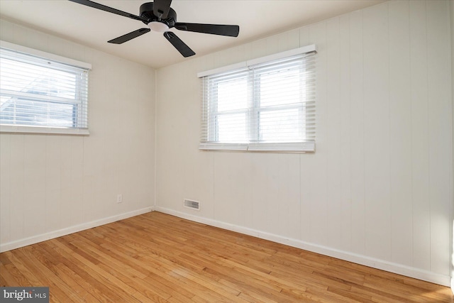 unfurnished room featuring ceiling fan and light hardwood / wood-style flooring