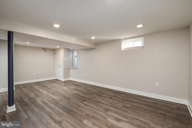 basement with dark wood-type flooring