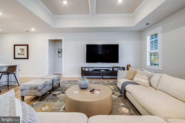 living room featuring hardwood / wood-style floors and ornamental molding