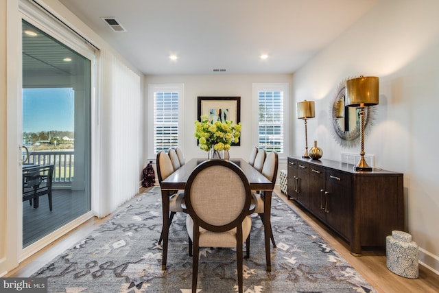 dining area with light hardwood / wood-style flooring