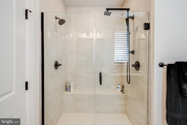 bathroom with a shower with shower door