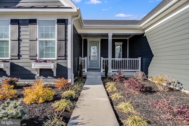 doorway to property with a porch