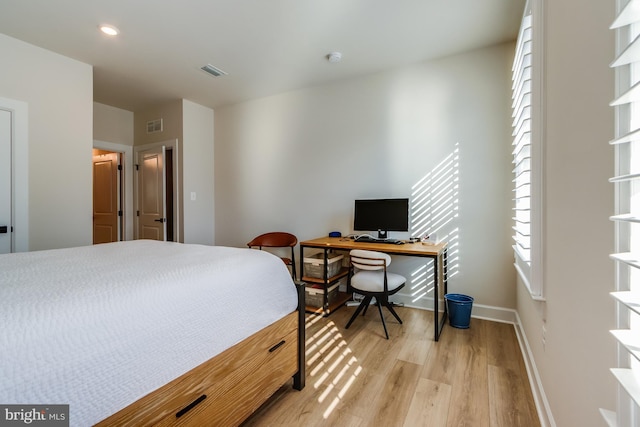 bedroom with light hardwood / wood-style floors