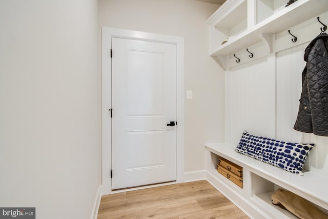 mudroom with light hardwood / wood-style floors