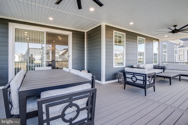 wooden terrace with outdoor lounge area and ceiling fan