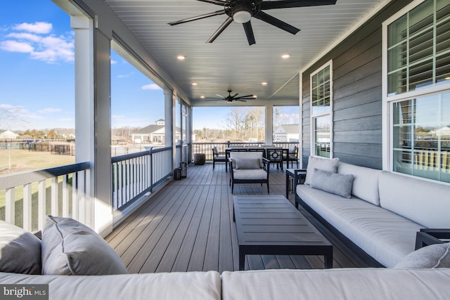 deck featuring outdoor lounge area