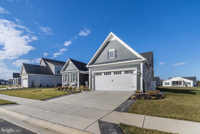 view of front of home with a garage and a front yard