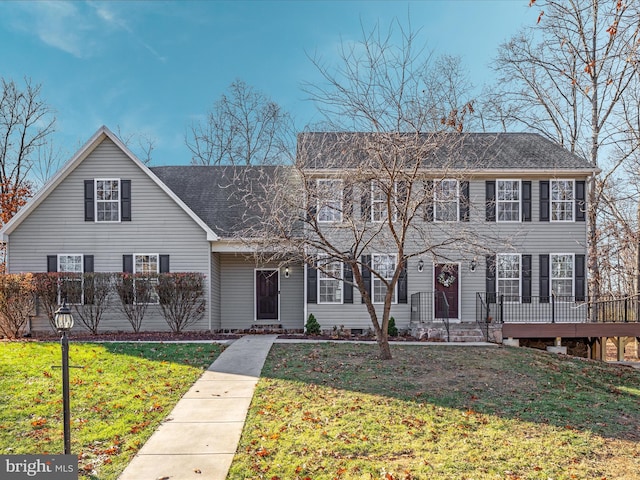 colonial home with a front yard