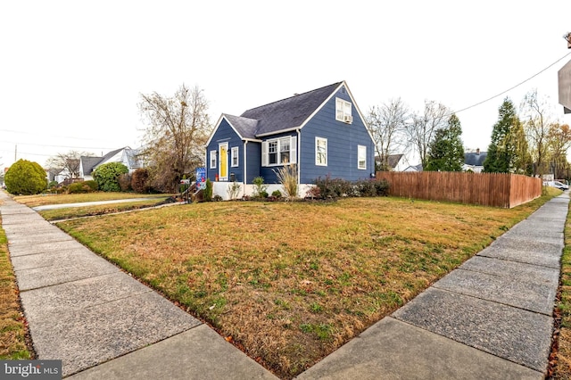 view of side of property featuring a lawn