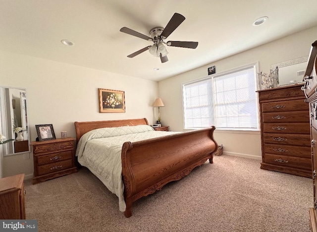 bedroom featuring ceiling fan and carpet