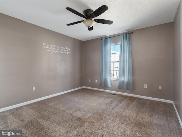 unfurnished room featuring visible vents, a ceiling fan, carpet flooring, a textured ceiling, and baseboards