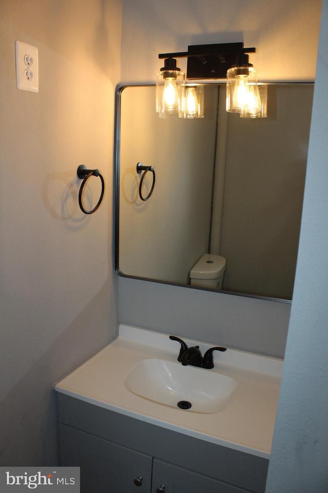 bathroom with vanity and toilet