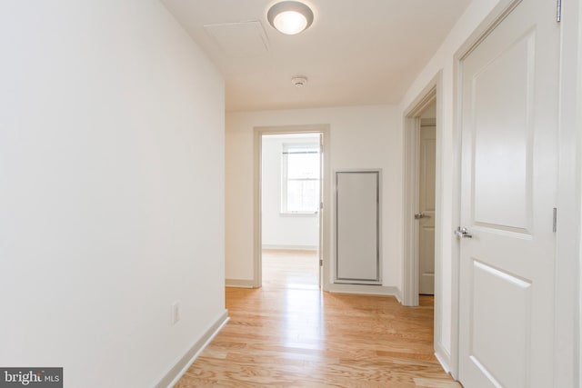 hall with light wood-type flooring