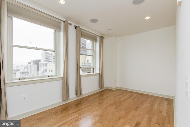 unfurnished room featuring light hardwood / wood-style floors