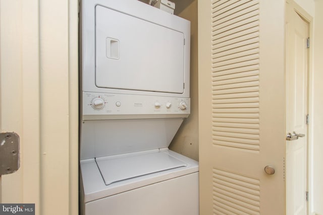 laundry room featuring stacked washer and dryer