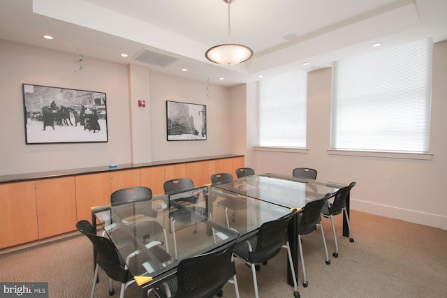 dining space with light colored carpet