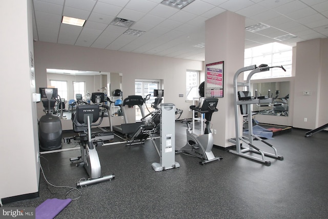 workout area with a paneled ceiling