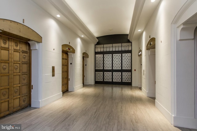 hallway featuring hardwood / wood-style flooring