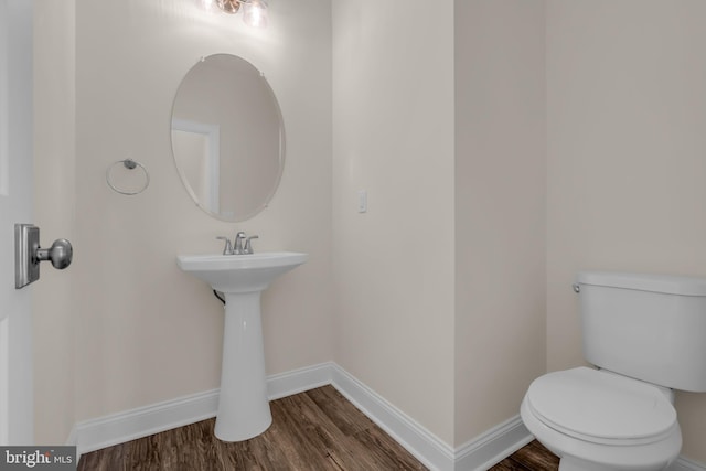 14 Mill Creek Ct, Bayville, NJ 08721 - bathroom with wood finished floors, toilet, baseboards, and a sink