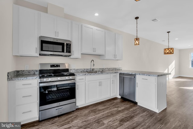 14 Mill Creek Ct, Bayville, NJ 08721 - kitchen featuring appliances with stainless steel finishes, a sink, a peninsula, white cabinetry, and dark wood-type flooring