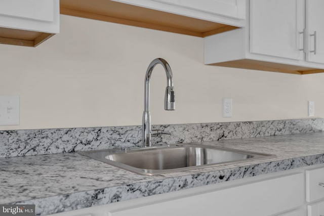 14 Mill Creek Ct, Bayville, NJ 08721 - kitchen view of a sink, white cabinetry, and light countertops