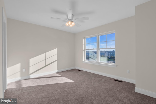 unfurnished room with carpet and ceiling fan